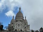 The Basilica de Sacre-Coeur (Basilica of the Sacred Heart) is built on the highest point in the whole city of Paris