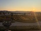 The sun sets over the gardens at the Château de Versailles, where the French king used to live