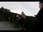 A woman played traditional Irish fiddle tunes at the Cliffs of Moher in the south