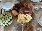 A spread I prepared for some visitors of cold cuts and vegetables, featuring kholodets, which is a Russian pâté