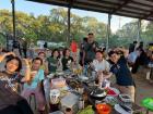 Here are some of my friends enjoying their BBQ—do you see the grill in the middle?