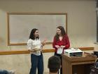 The other English Teaching Assistant and I giving a presentation on cultural celebrations in the U.S. to our Portuguese class