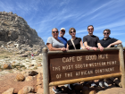 Family photo at the southwestern edge of Africa, where ocean and rugged coastline meet.