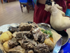 боодог / Boodog, a traditional dish made with goat meat cooked inside its own skin using hot stones, the skin is sealed with chopped meat, potatoes, carrots and hot stones inside