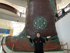 This is a giant Mongol gutal (traditional Mongolian boot) in a museum, a traditional leather footwear style from Mongolia, known for its slightly upturned toe tips