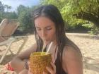 Enjoying pineapple juice on the beach!