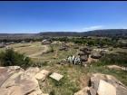 Thaba Bosiu Cultural Village with traditional rondavel buildings