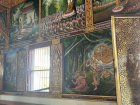 Murals inside the temple depicting stories from the life of the Buddha, used to teach moral values and Buddhist teachings across generations