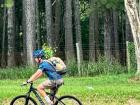 Another volunteer biking 50 kilometers back to his site with his trees