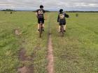 My friends on bike in a vast open green space
