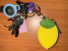 This is my small, lemon-shaped coin purse attached to my keys 