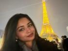 Selfie with the famous Eiffel Tower in Paris which turns golden at night