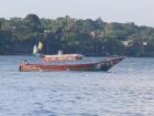 A boat on Lake Victoria travels to different islands