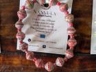 A bracelet made from paper beads makes a beautiful accessory that helps save the planet