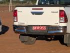 Government vehicles have red and white tags