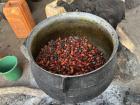 This is someone preparing palm oil from palm nuts, this is how many people make their living
