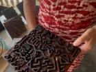 My friend choosing a stamp design she likes for her batik