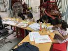 Students in Kids Club work on their English assignments together.