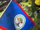 The Belizean flag, the only one in the world that has humans on it