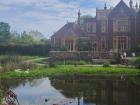 The garden has pond, and an old manor with a cafe inside