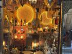 A shop filled with many colorful lamps in the medina