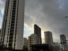 A cloudy sky on a busy street