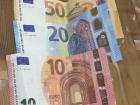 These are some examples of Euro bills, which vary in size and color according to their value
