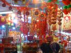 A storefront with all the hallmarks of the Chinese New Year celebrations