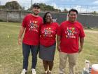 Two members of my school's sports committee and me at a football tournament