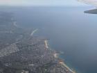 The northern beaches as seen from an airplane. Collaroy and Narrabeen beaches are the furthest away.