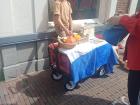 A kid selling something on the street!