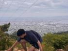 Climbing rocks with a view of the city in the background!