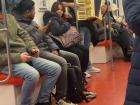 A performer playing music on the train