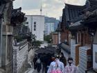 Women wearing hanbok at a traditional Korean village