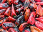 The ajvarka peppers being roasted on the grill