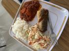 Tomato stew with rice, a side of salad and fish.