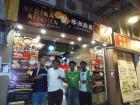 With my friends in front of the Nigerian restaurant