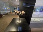 A bronze sculpture of many hands holding each other, like how the EU countries hold and support each other