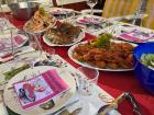 Place settings for kräftskiva dinner; the paper included the words for the snapsvisa (songs)