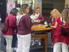Food stands flood the streets with Spanish specialties... including paella!