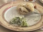 Homemade pyzy with savory mushroom filling, served alongside a Polish side salad (mizeria)