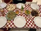 A spread of Polish dishes, featuring potato pierogi (pierogi z ziemniakami), salmon tartar (tatar z łososia) and mushroom kasha (kasza z grzybami)