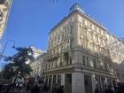 A photo showcasing a building and cloudless weather