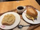 A breakfast of Streuselbrötchen, coffee, and a Brötchen with egg