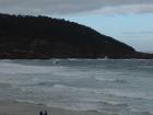 A view of a group of surfers getting ready to hop in the water