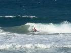 A snapshot of a professional surfer catching a wave