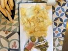 The tapas shown here are the gilda de matrimonio, Asturian cabra cheese and assorted chips and crackers