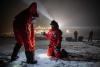 MOSAiC team members conduct fieldwork on Arctic ice