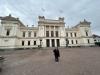 Feeling tiny in front of the grand ceremonial building of Lund University, with its towering flags waving above!