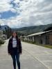 Profile picture of Darby standing in her town in Molinopampa, Peru